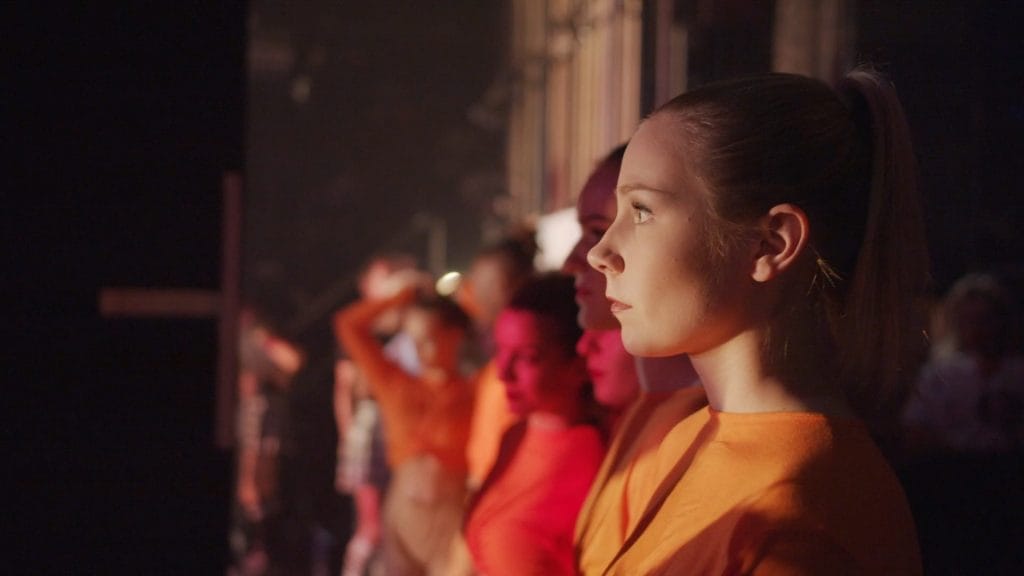 Young performers backstage during a production