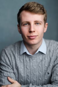 London Studio Centre student and Project Dance founder James Bamford in a grey knitted sweater